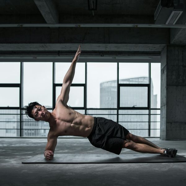 Person holding a strong yoga pose, showing balance and stability.